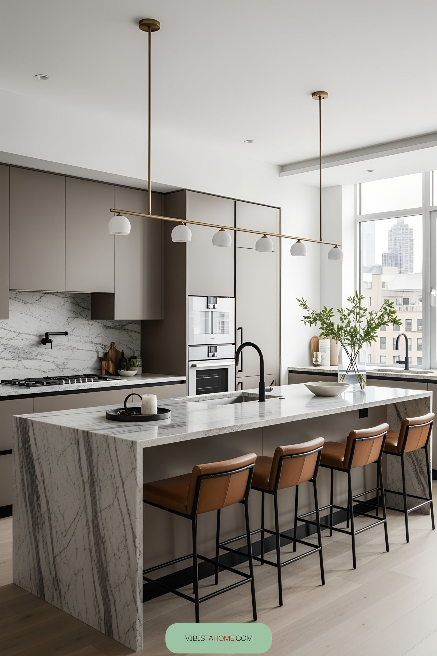 Modern kitchen featuring marble counters and sleek cabinets