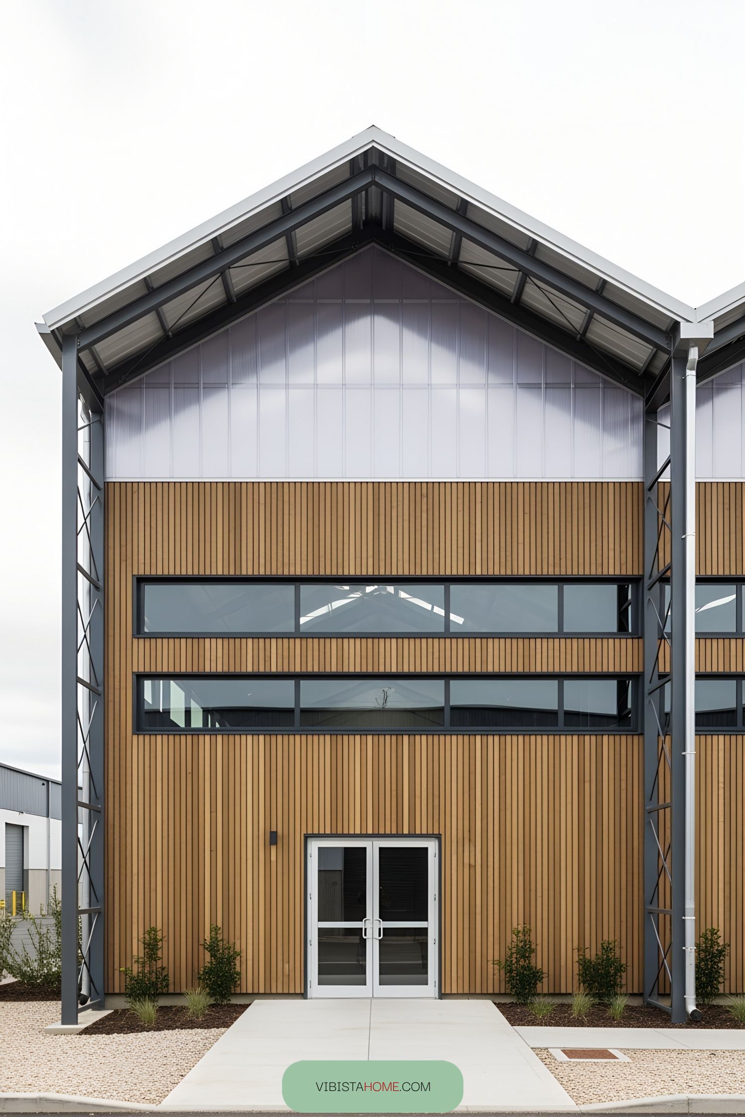 Industrial factory facade with wooden panels and large windows