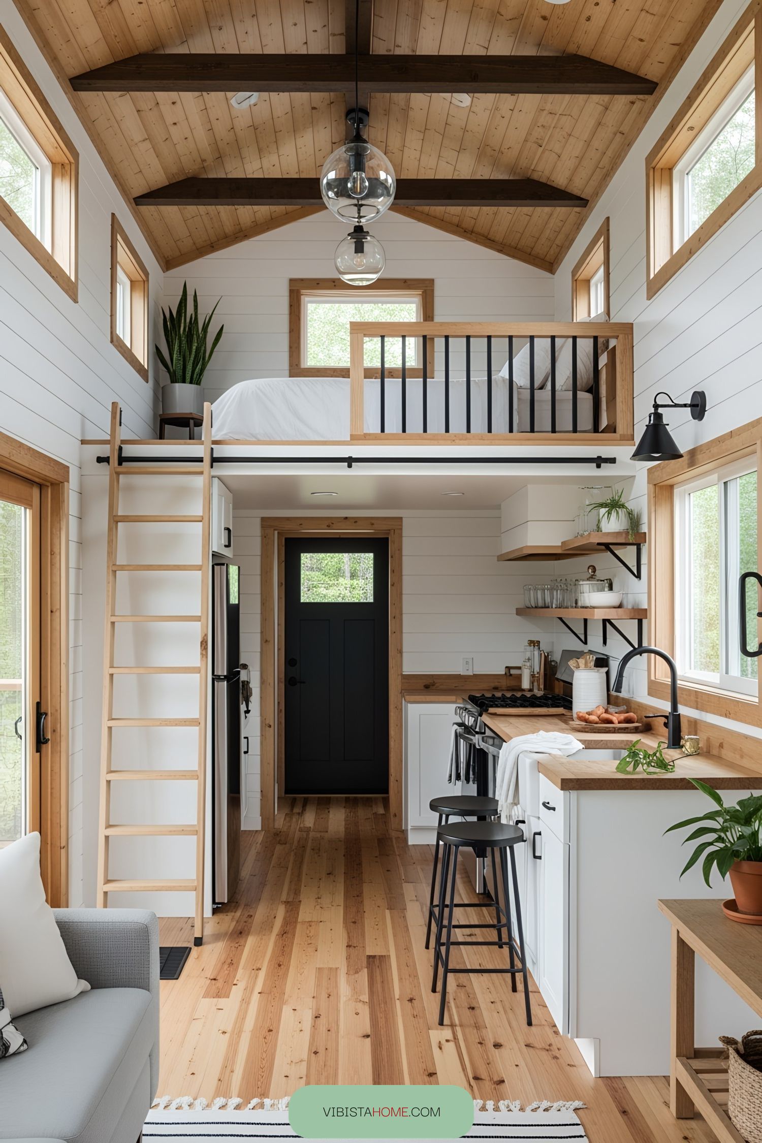 Interior of a cozy lofted tiny house with wooden accents