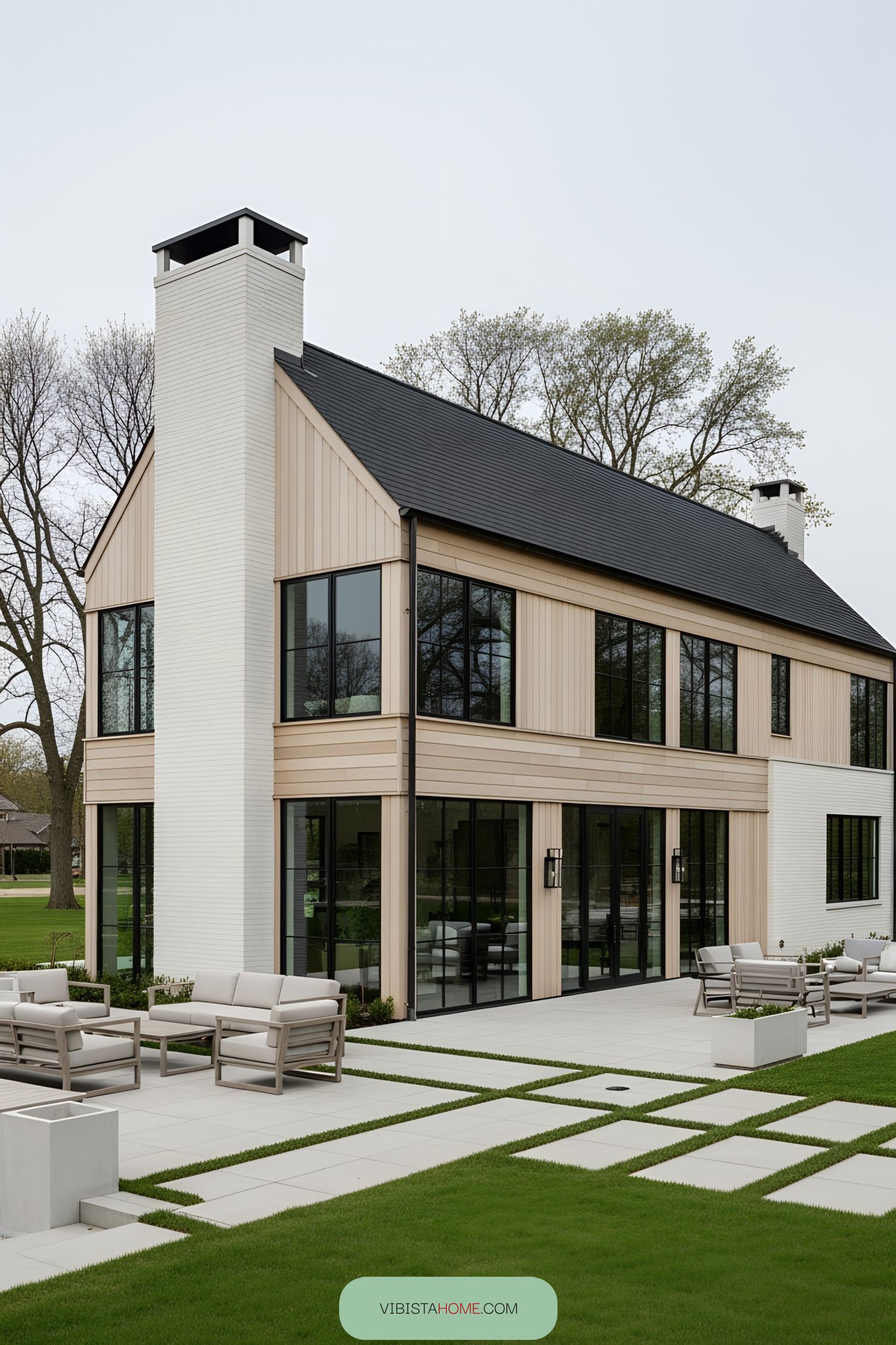 Modern Scandinavian farmhouse with large glass windows and simple wooden design