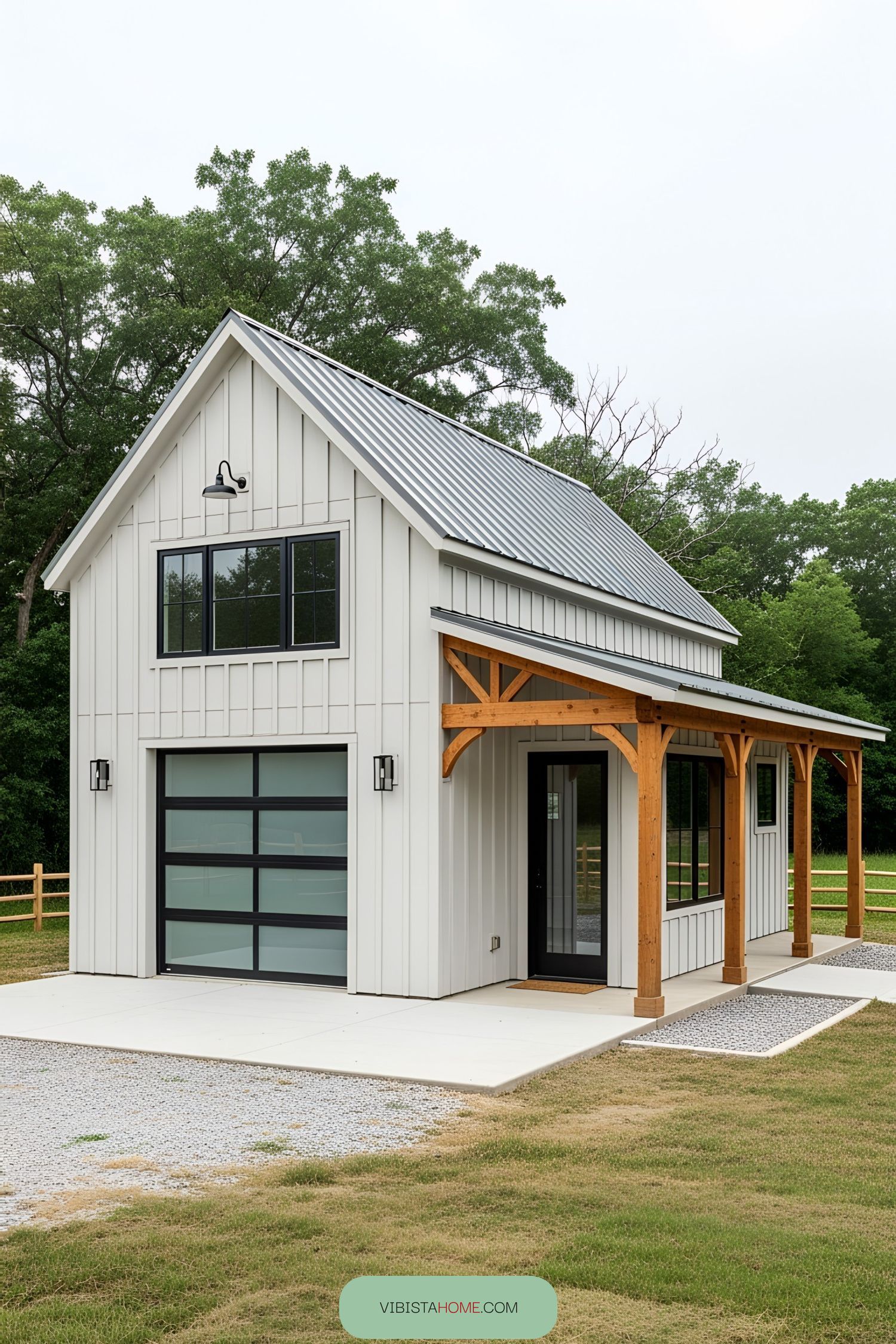 Cozy white barndominium with modern windows and wooden accents