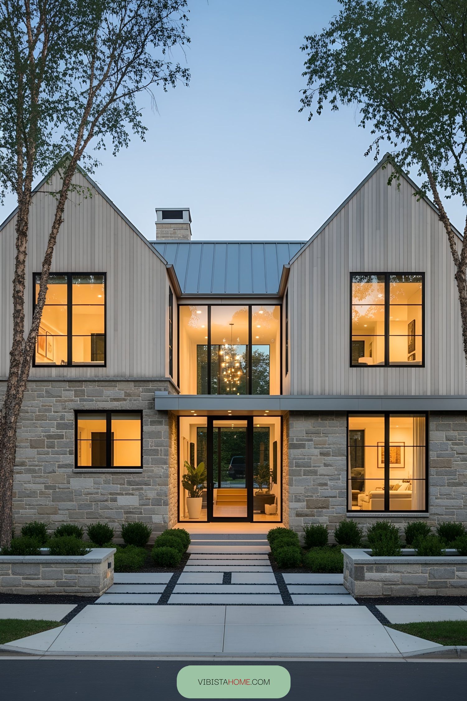 Modern Scandinavian farmhouse with large windows and stone facade