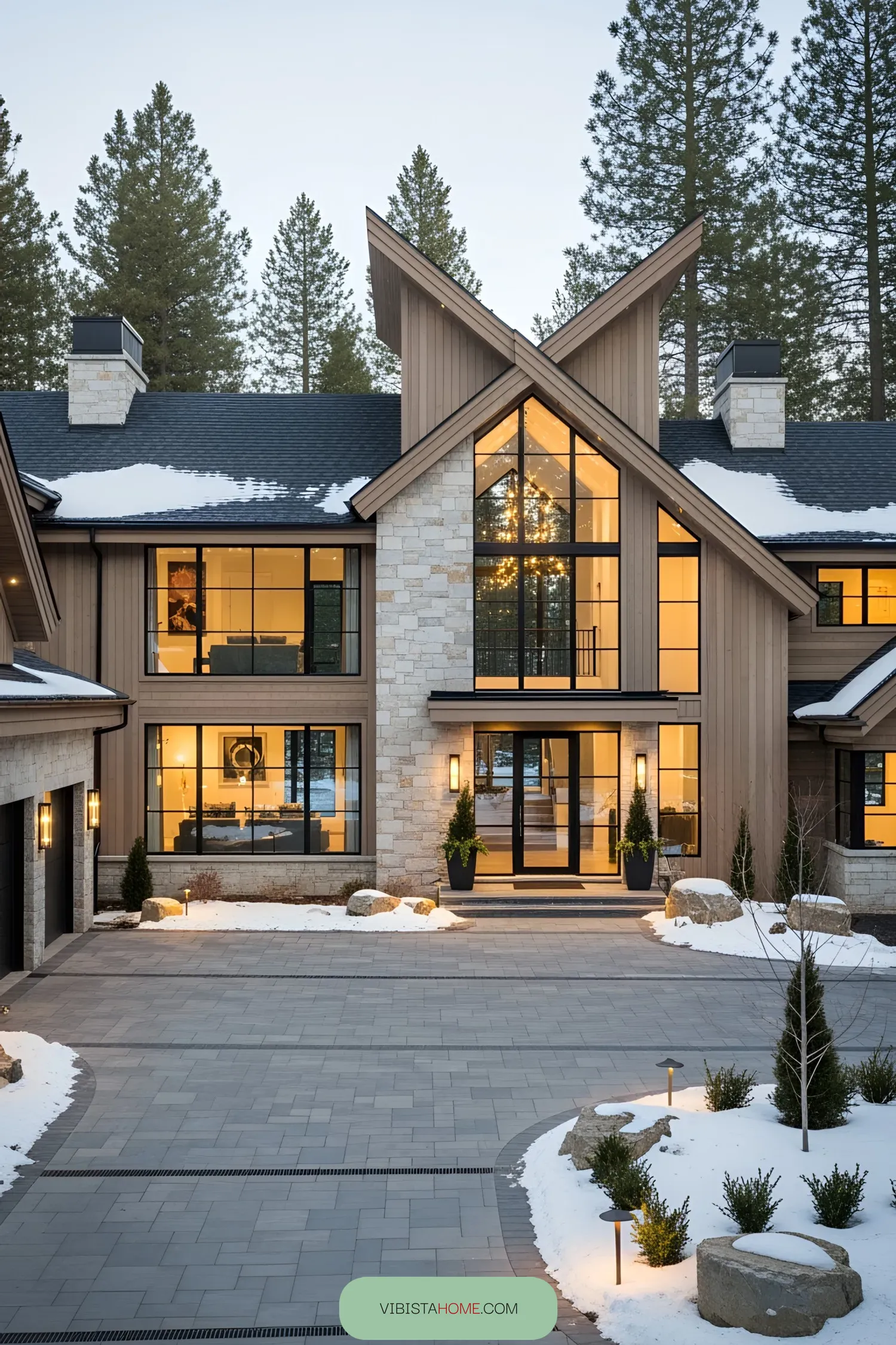 Luxurious chalet with large windows amidst a snowy landscape