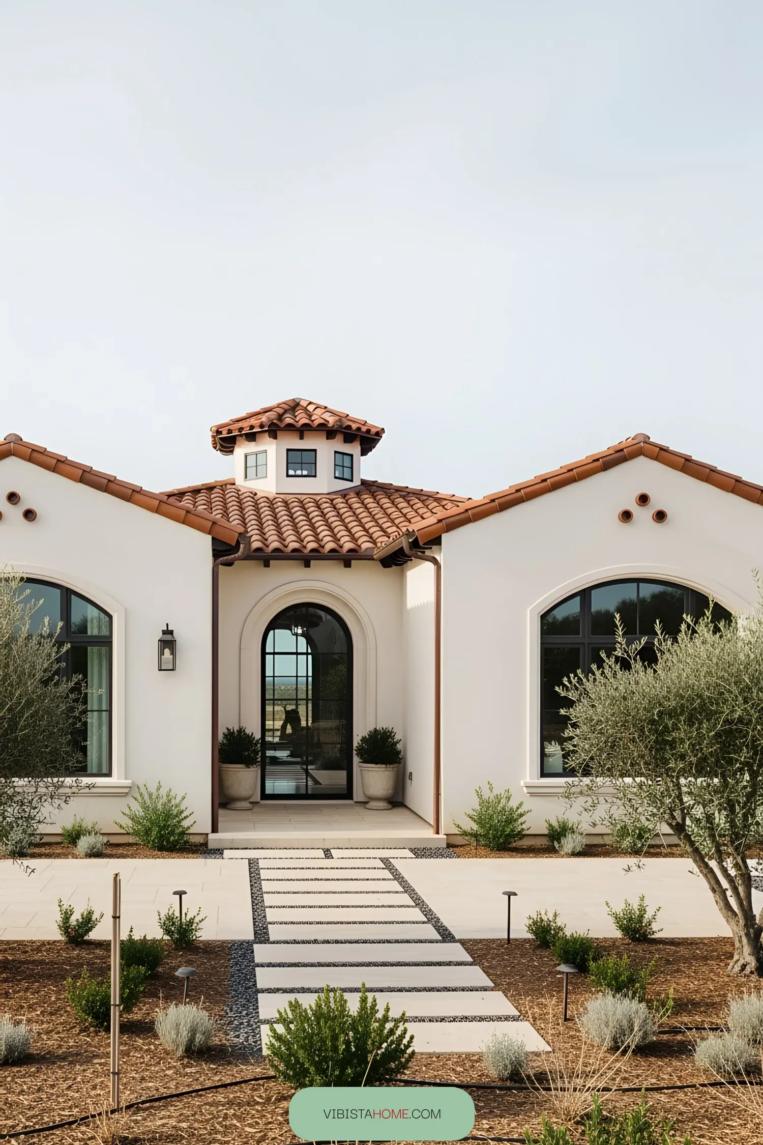 Charming coastal house with terracotta roof and arched windows