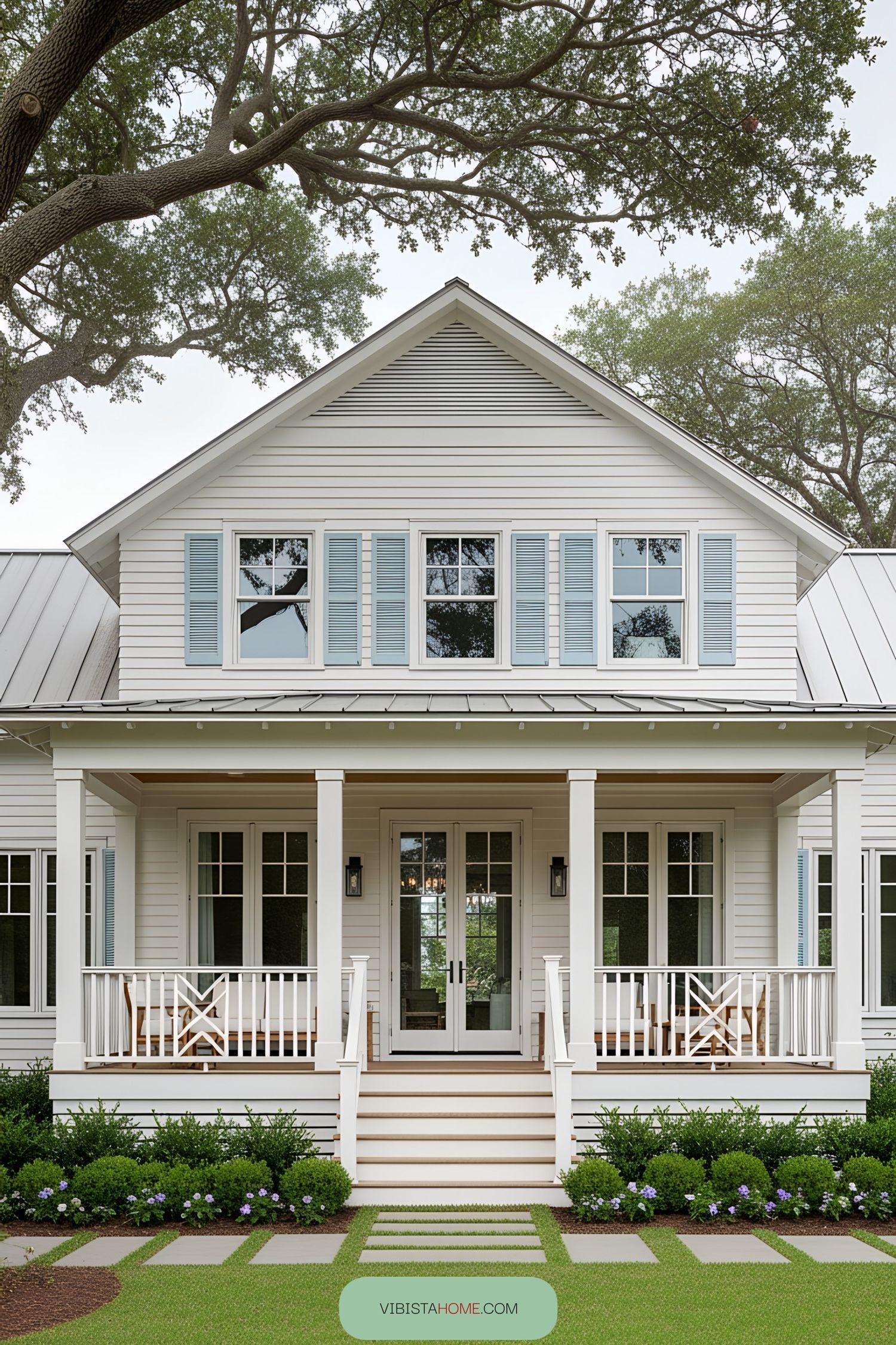 White bungalow with blue shutters and a front porch