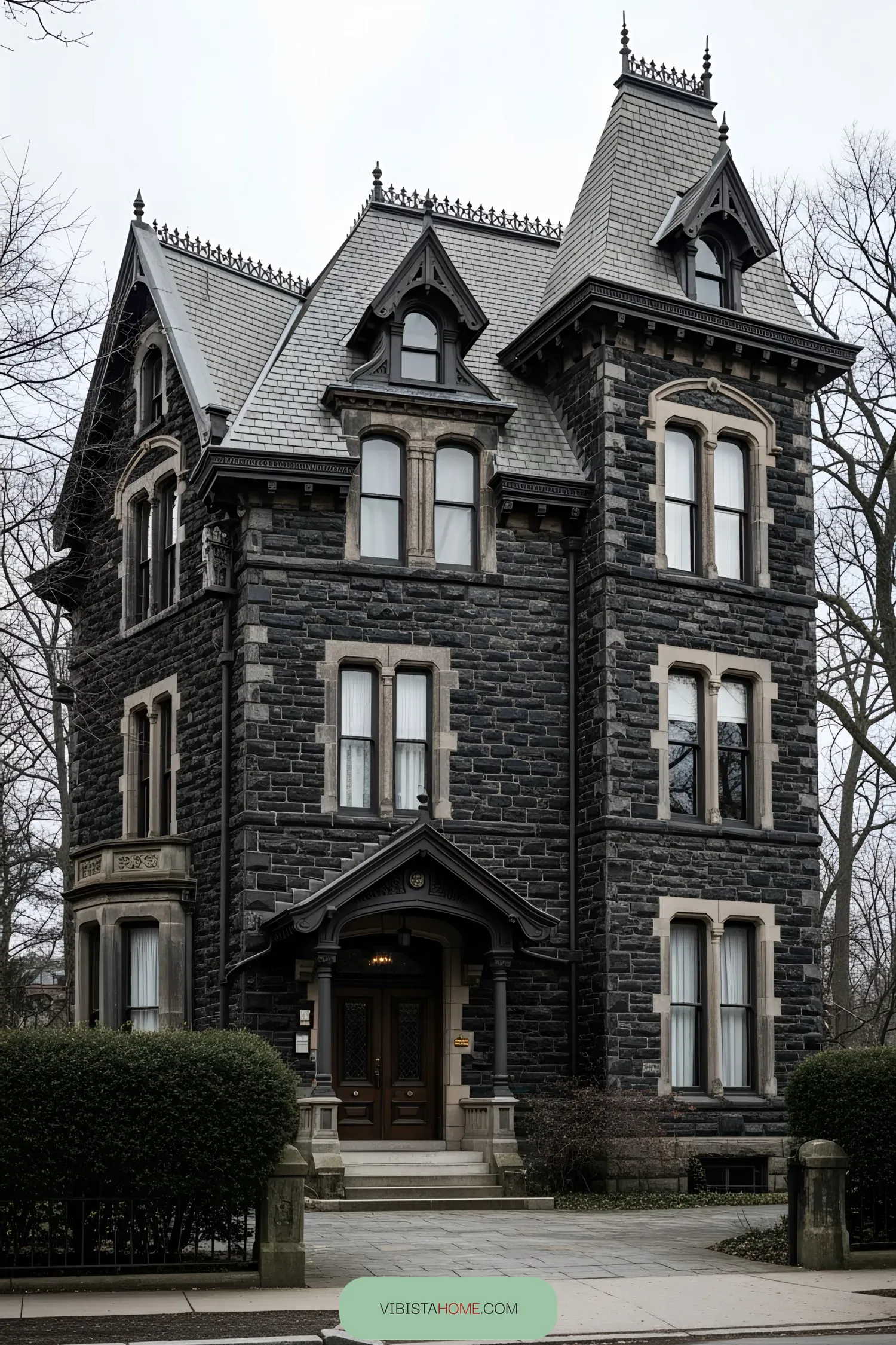 Dark Victorian-style house with intricate details