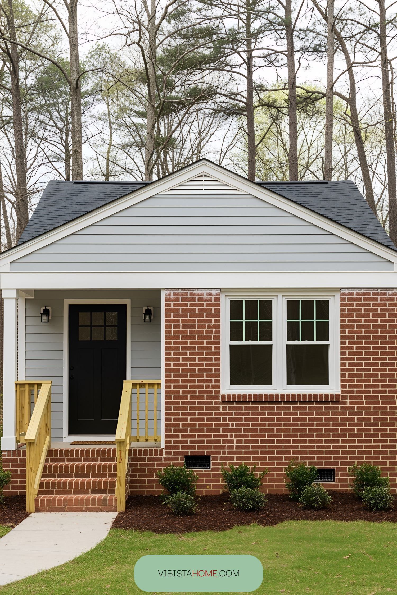 Compact cottage with brick and wood siding