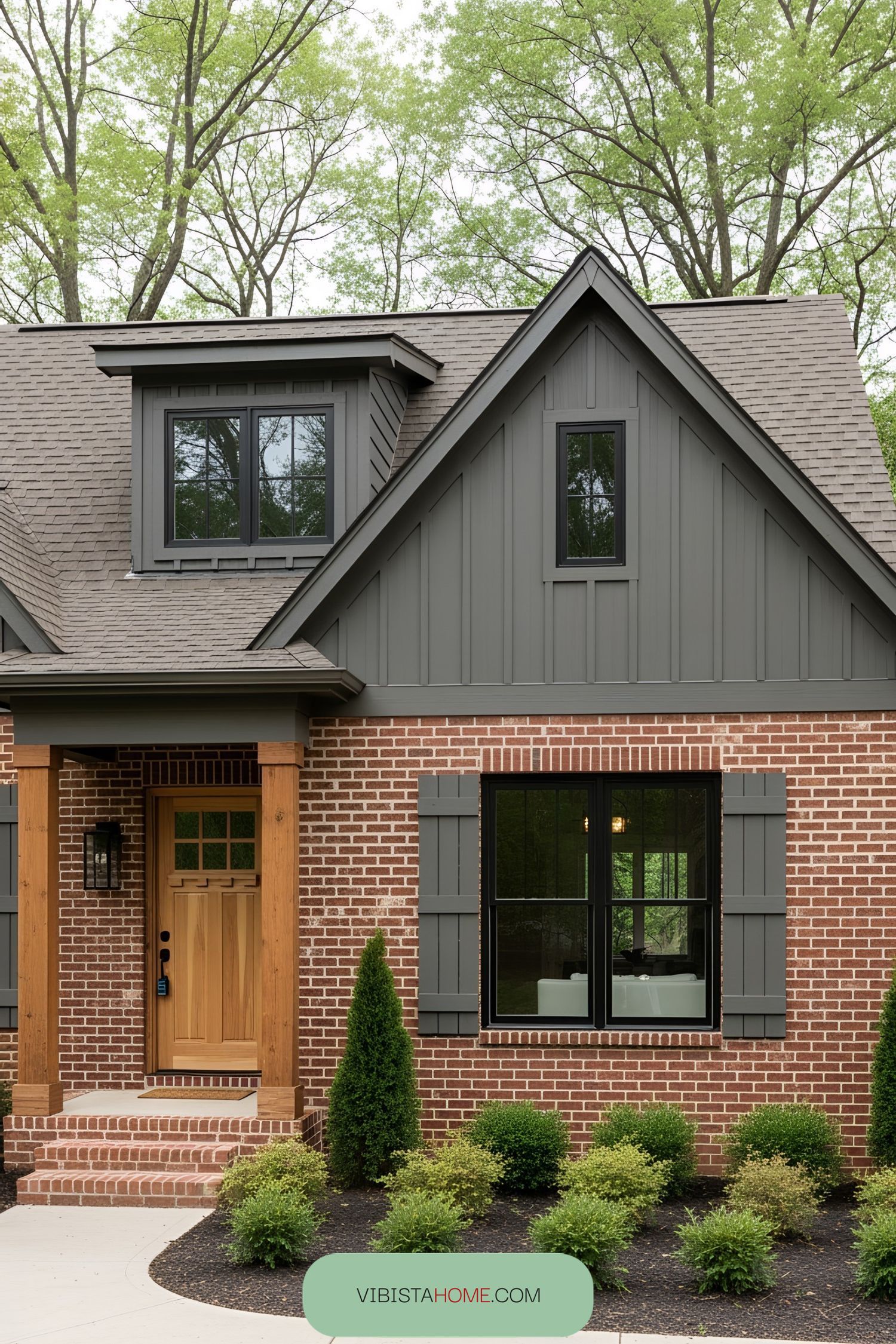 A charming cottage with brick and wood siding