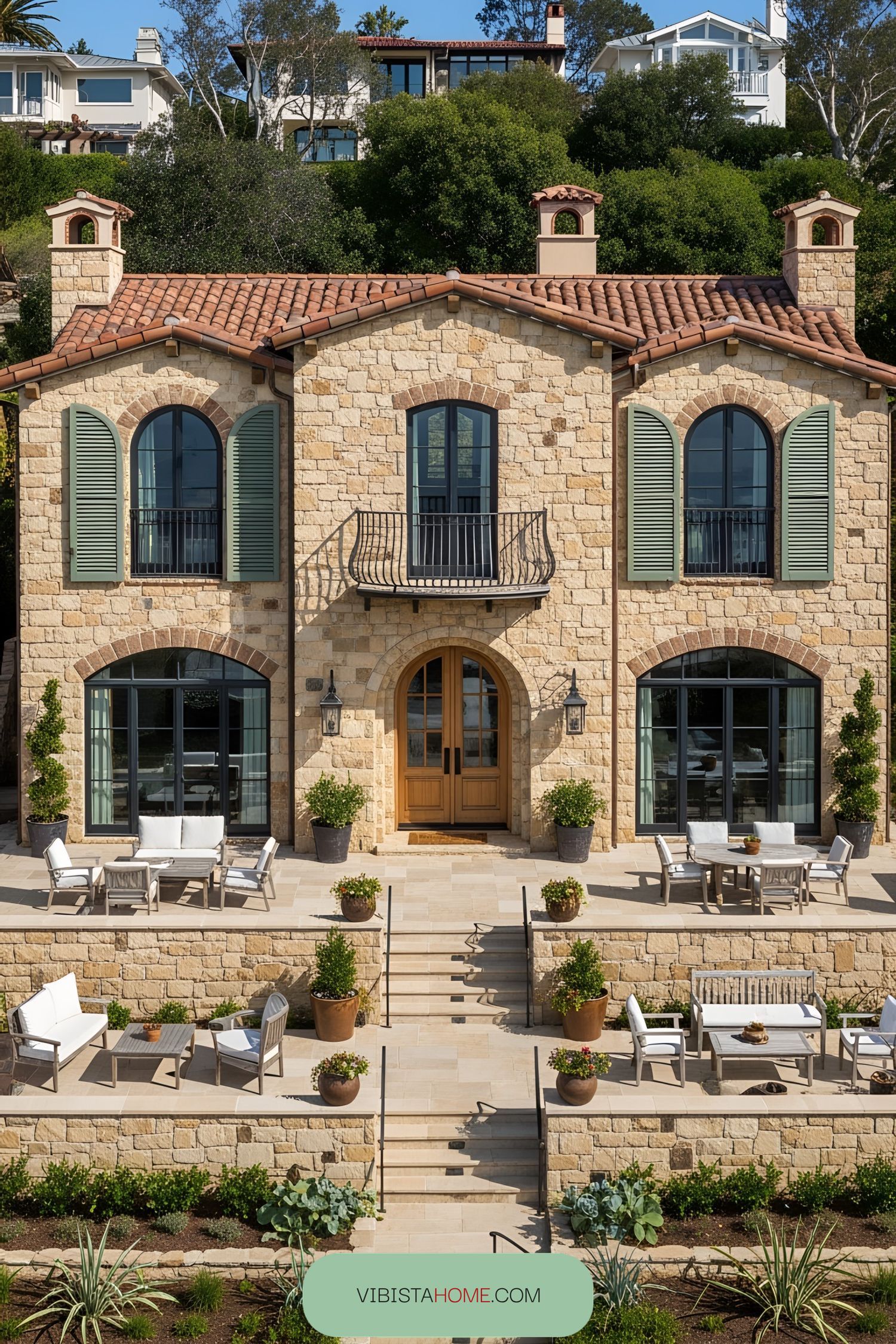 Stone villa with green shutters and spacious patio