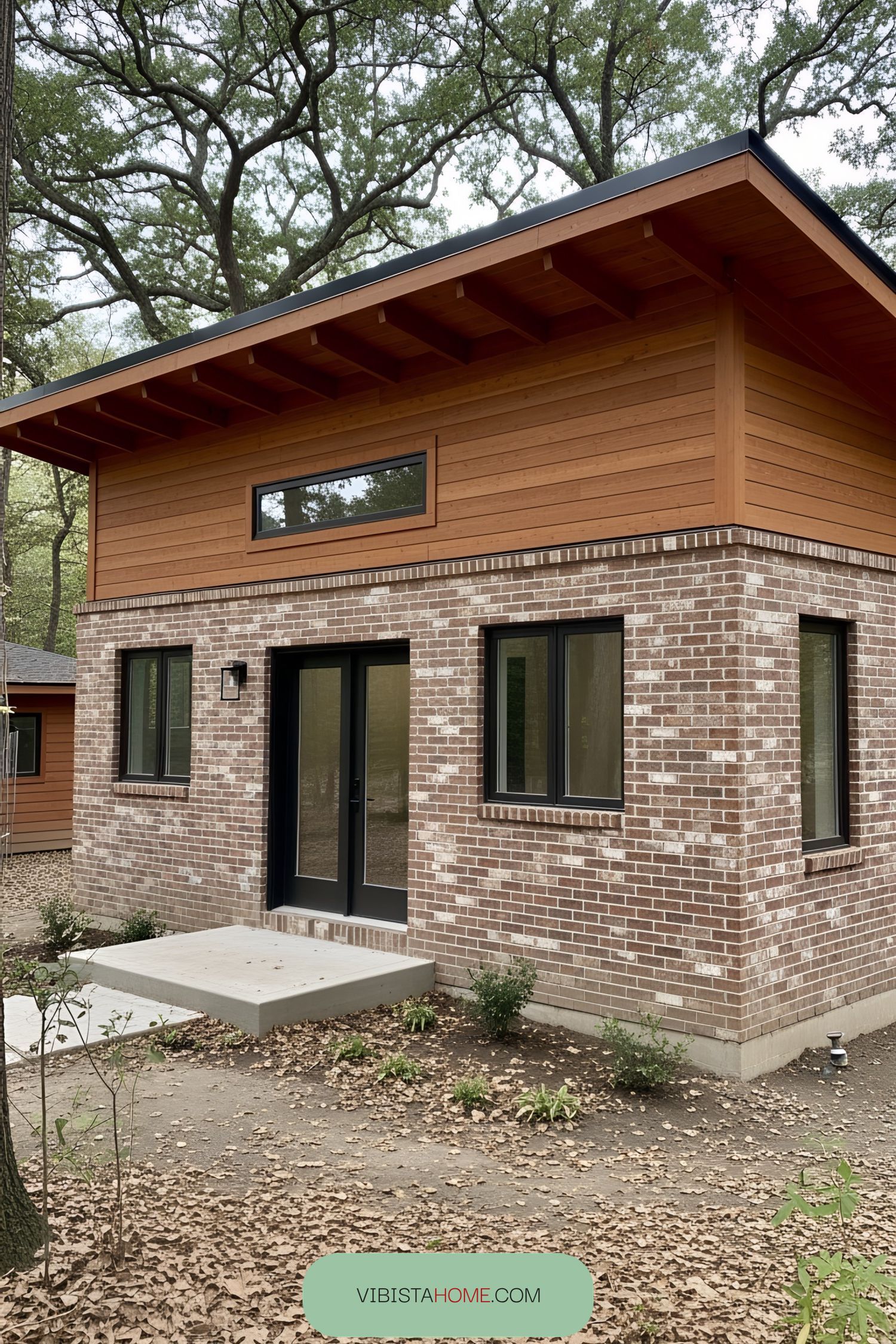 Charming cottage with mixed brick and wood siding